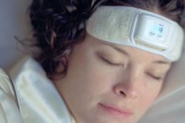 Woman wearing SleepGuard headband